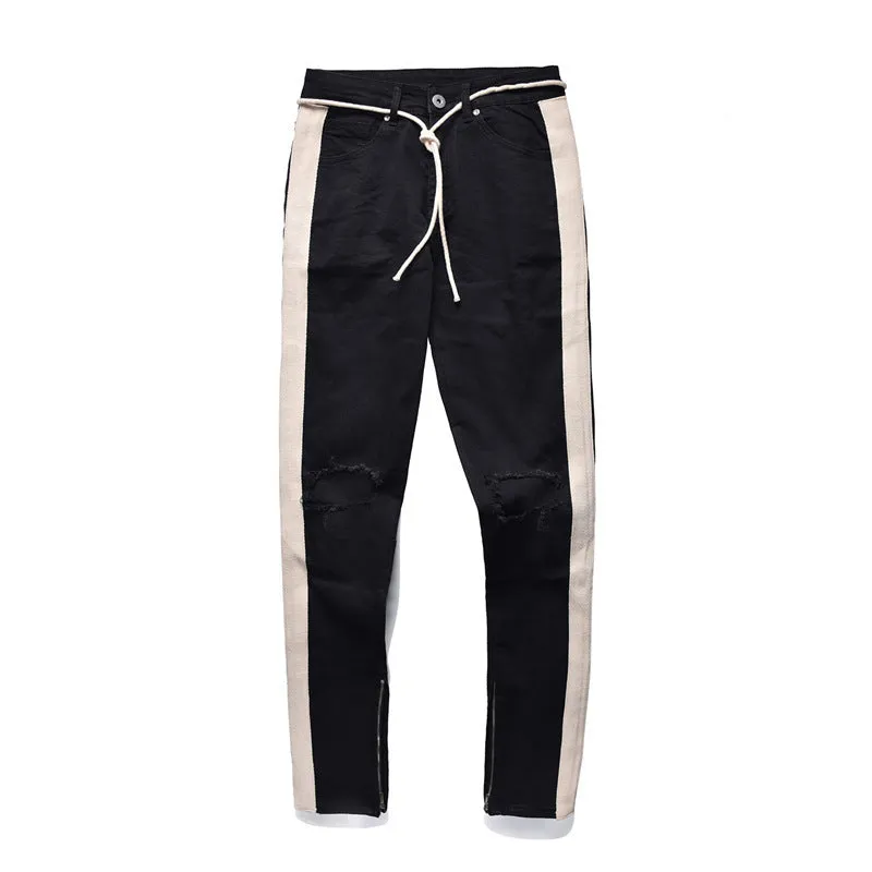 Men's cotton ripped jeans in black showing distressed knee details, front view