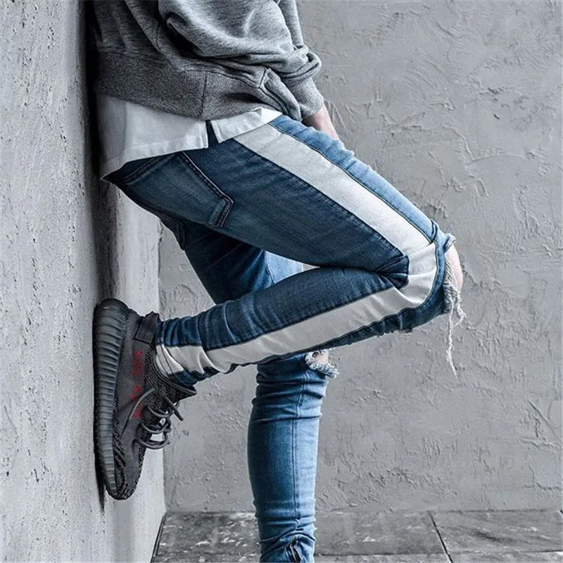 Men's cotton ripped jeans in black showing distressed knee details, front view