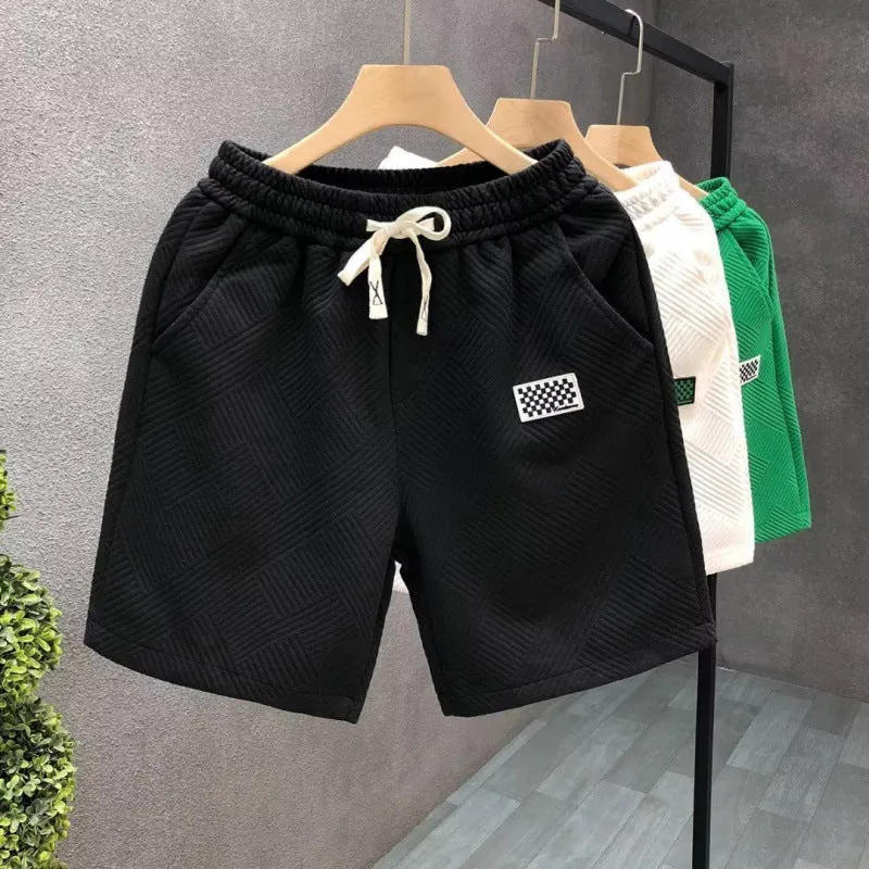 Men's solid colour casual sports shorts with micro elasticity in white, black, or green options