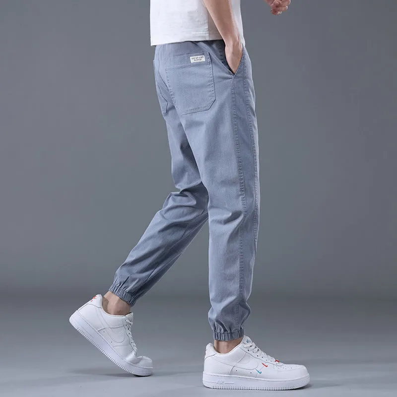 Men's casual loose drawstring pants in black, tapered high-waist solid colour cotton-blend trousers