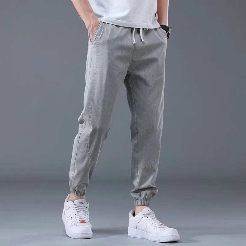 Men's casual loose drawstring pants in black, tapered high-waist solid colour cotton-blend trousers