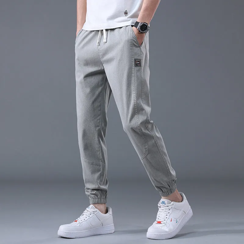 Men's casual loose drawstring pants in black, tapered high-waist solid colour cotton-blend trousers