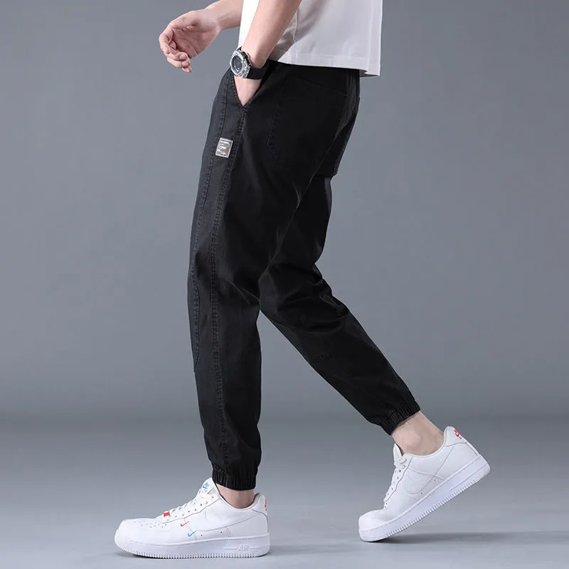 Men's casual loose drawstring pants in black, tapered high-waist solid colour cotton-blend trousers