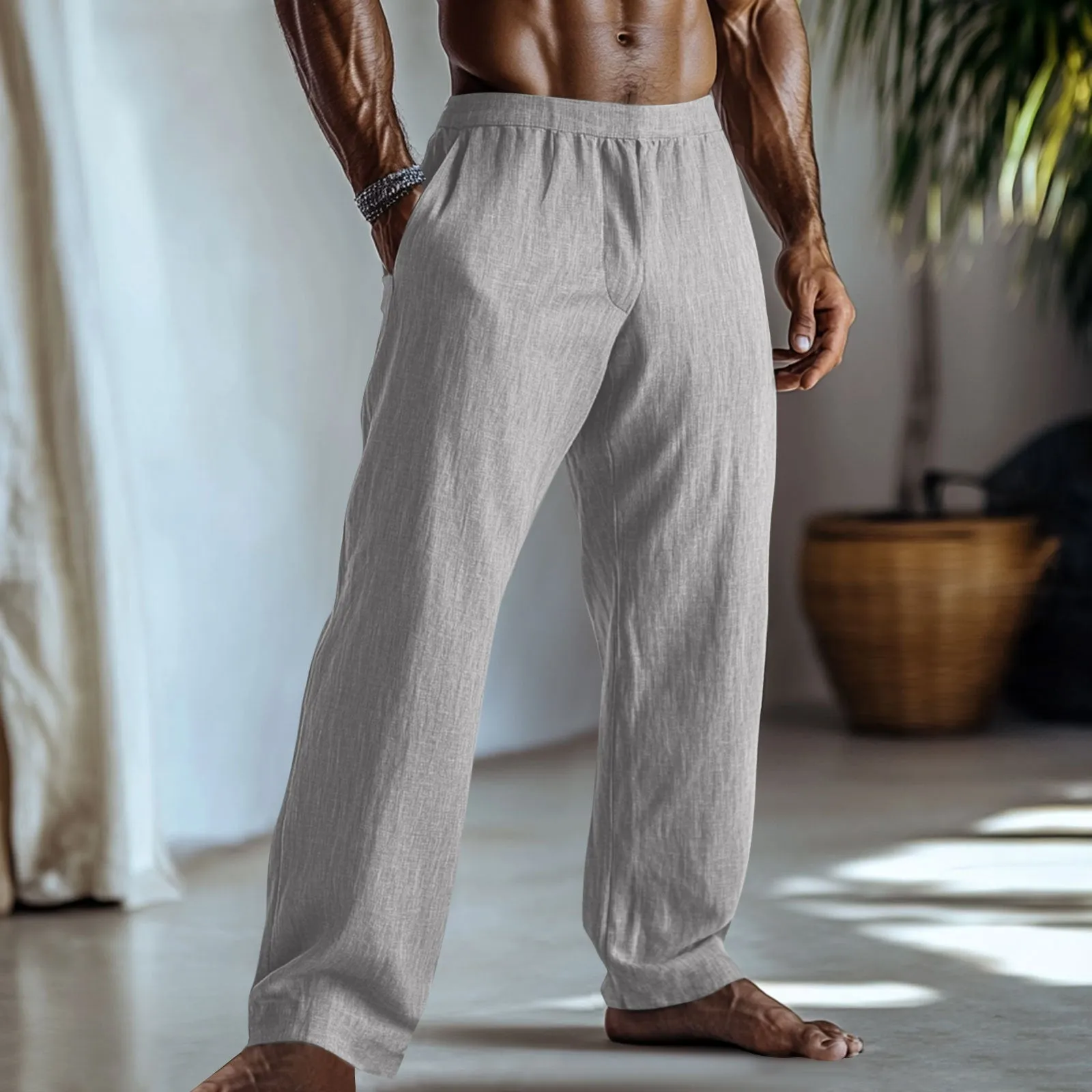 Straight leg casual trousers in cotton and linen fabric, shown in light green colour with side pockets.