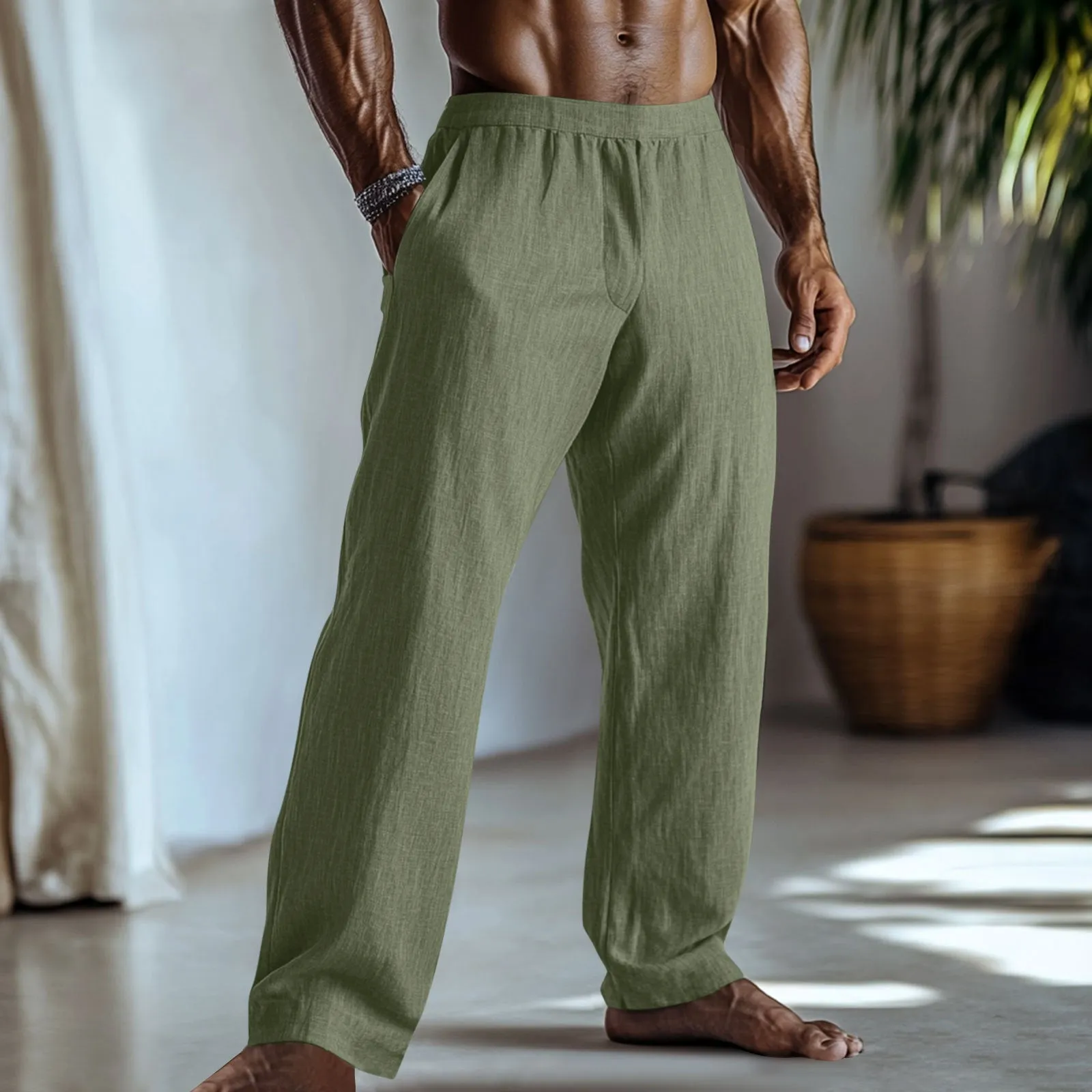 Straight leg casual trousers in cotton and linen fabric, shown in light green colour with side pockets.