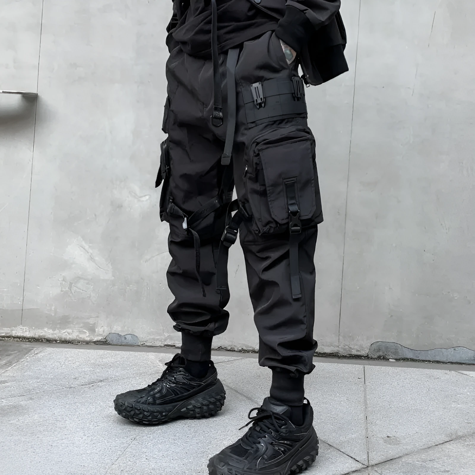 Men's black casual overalls loose fit binding hem trousers front view on mannequin