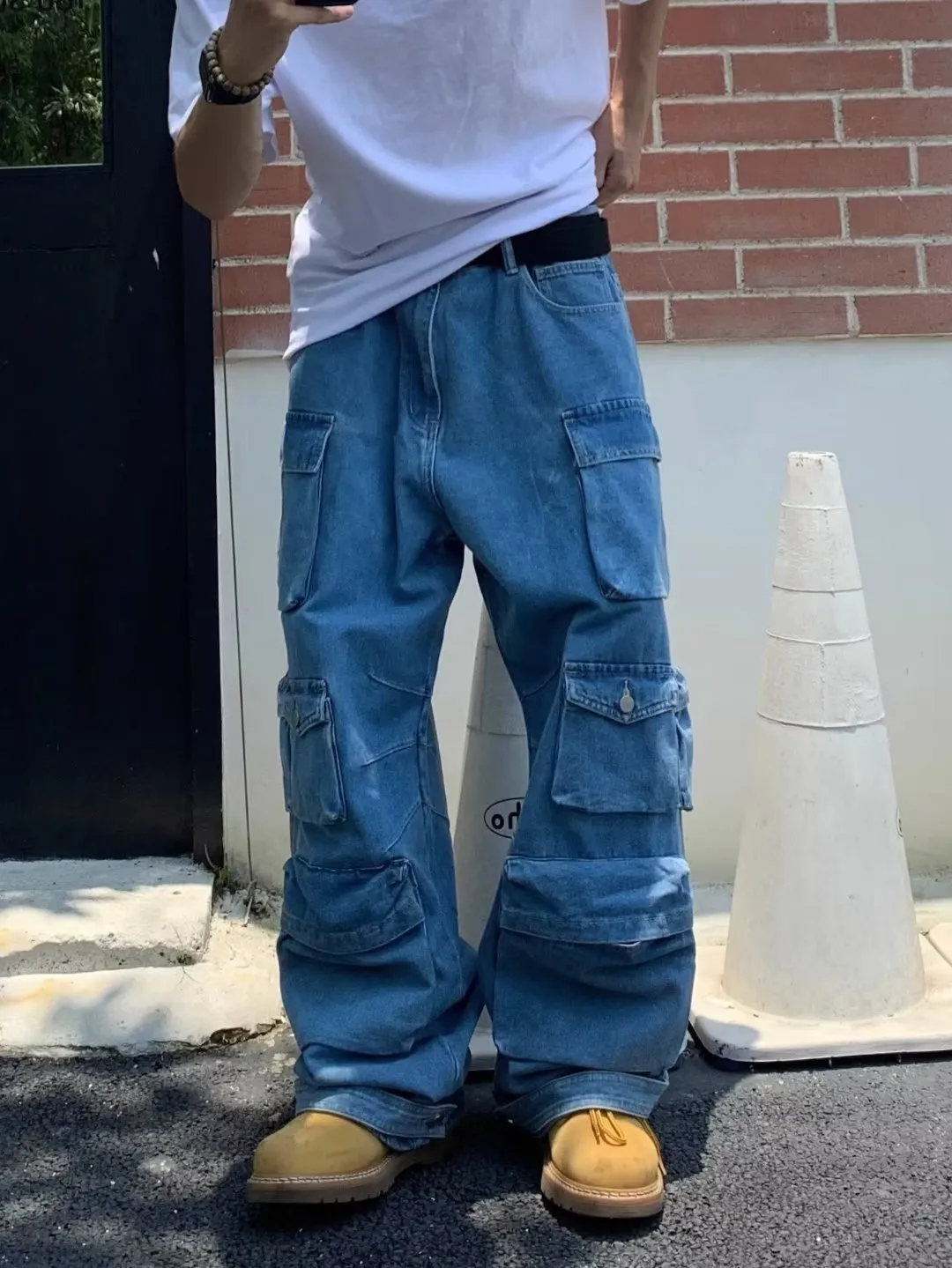 Men's blue straight-leg denim jeans with mid-waist and zip fly