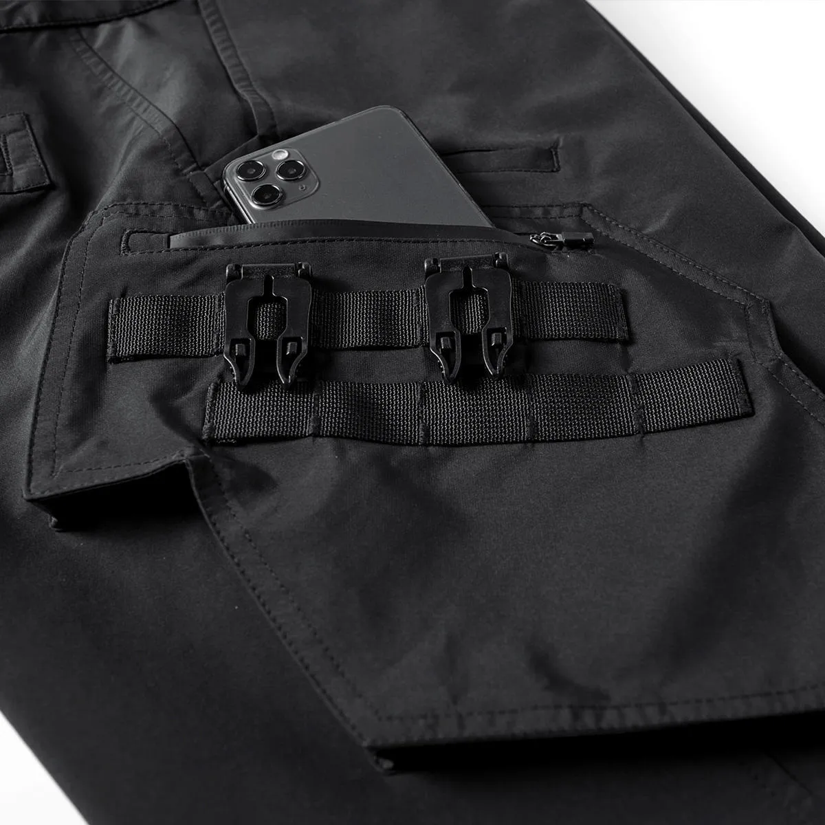 Men's black multi pocket parachute pants loose fit with mid waist and wrinkle-resistant polyester fabric