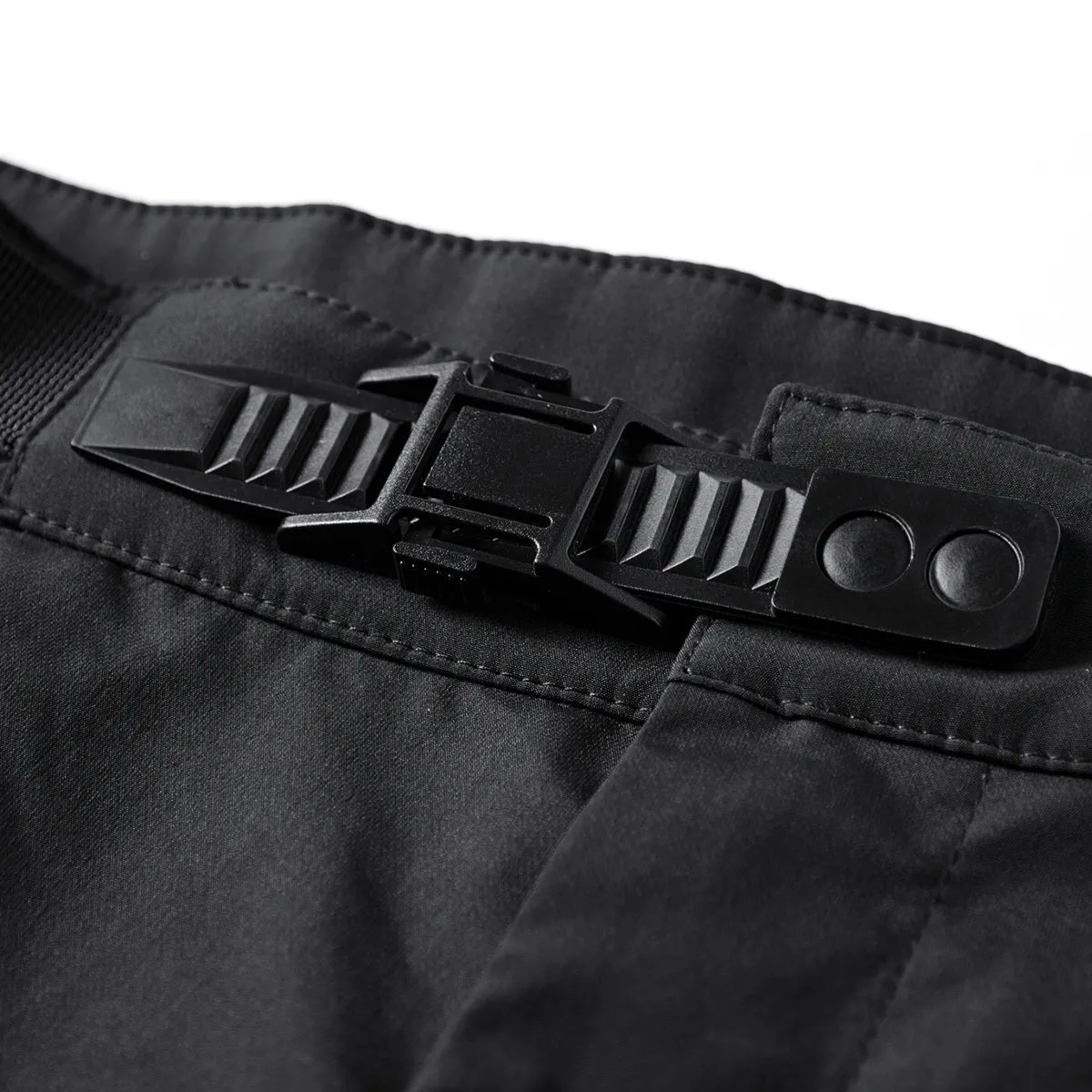 Men's black multi pocket parachute pants loose fit with mid waist and wrinkle-resistant polyester fabric