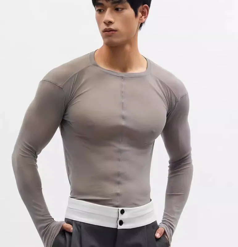 Black slim-fit long sleeve pullover top with mesh see-through texture.