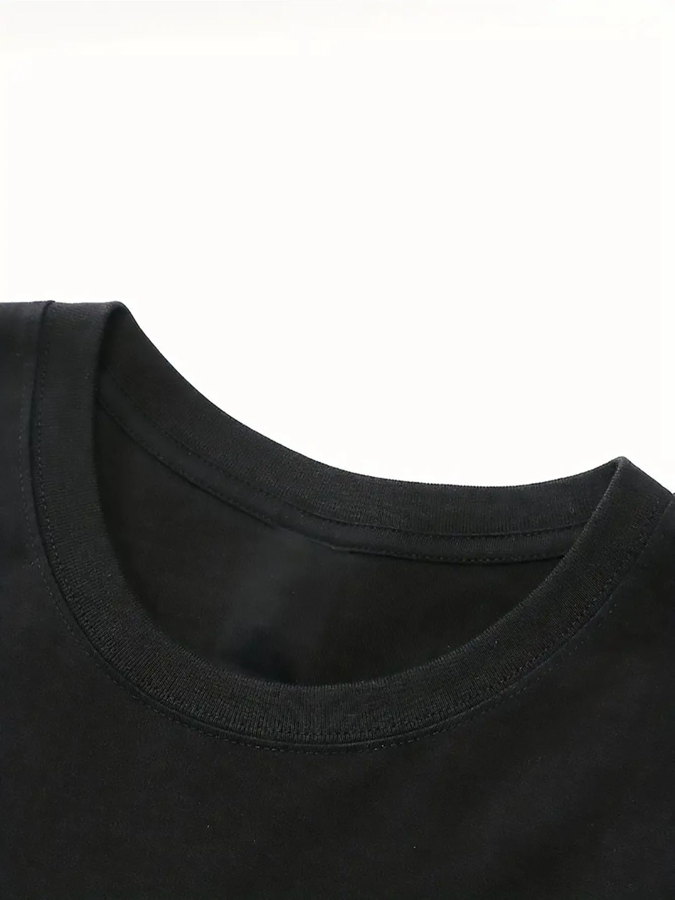 Black cartoon printed short sleeve cotton T-shirt on plain background
