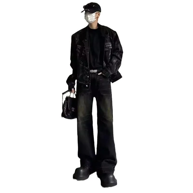 Mens washed black straight leg denim jeans with dirty mud texture and zip fly
