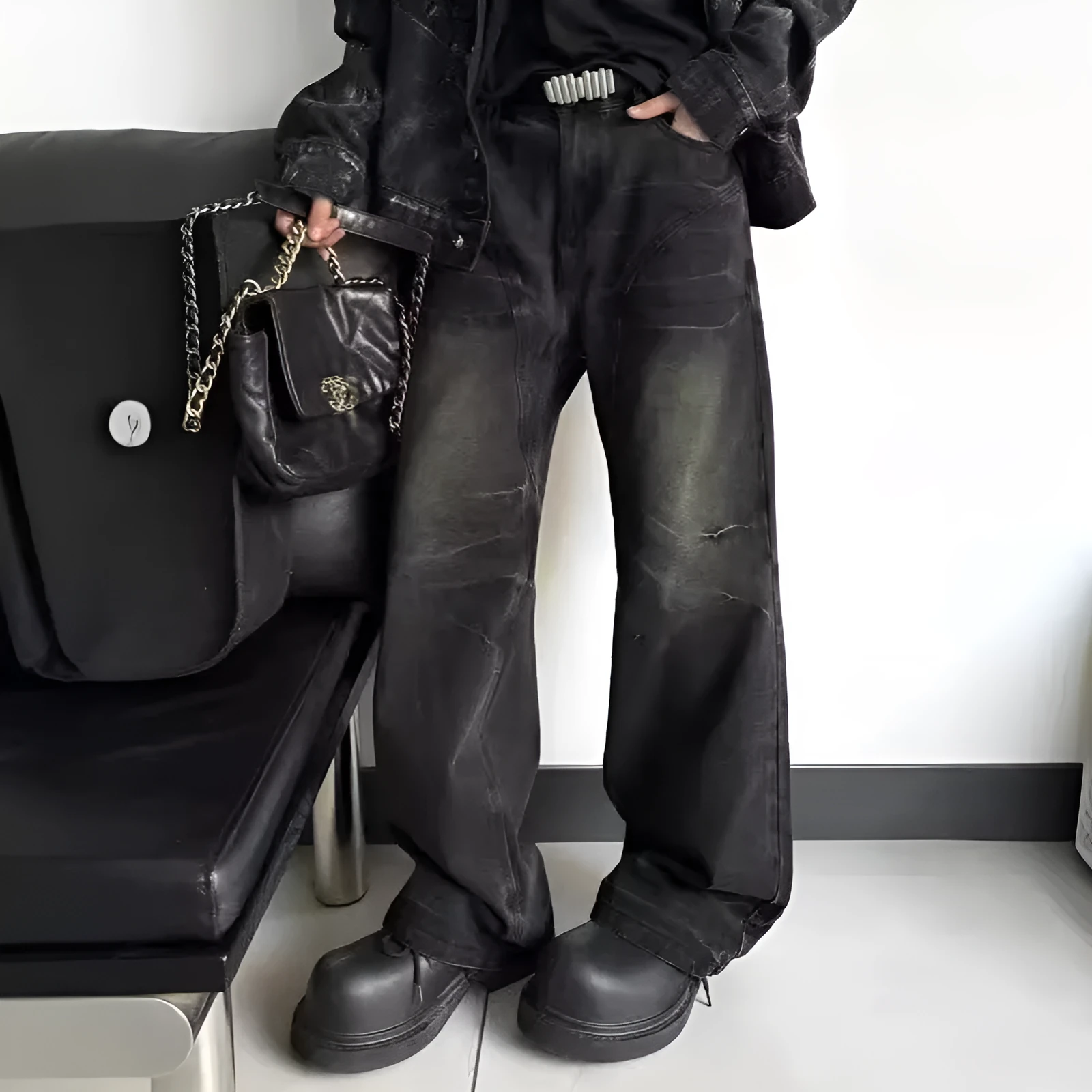 Mens washed black straight leg denim jeans with dirty mud texture and zip fly