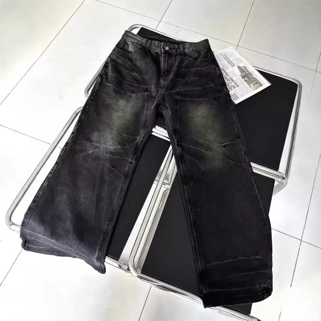 Mens washed black straight leg denim jeans with dirty mud texture and zip fly