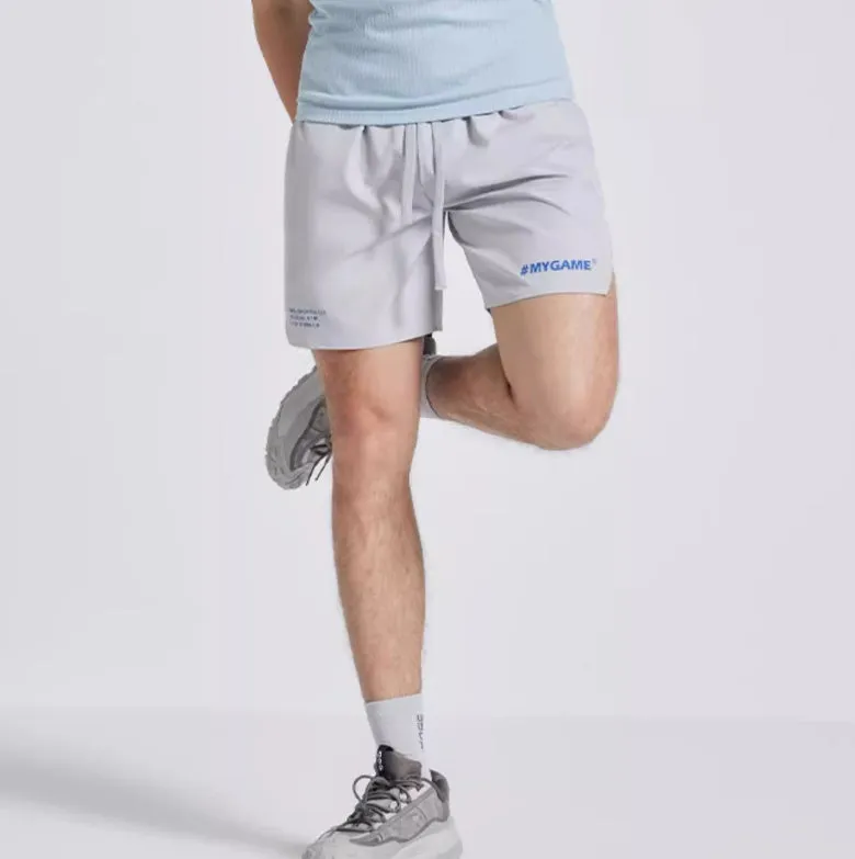 Men's navy blue training shorts with moisture-wicking fabric on a grey background.