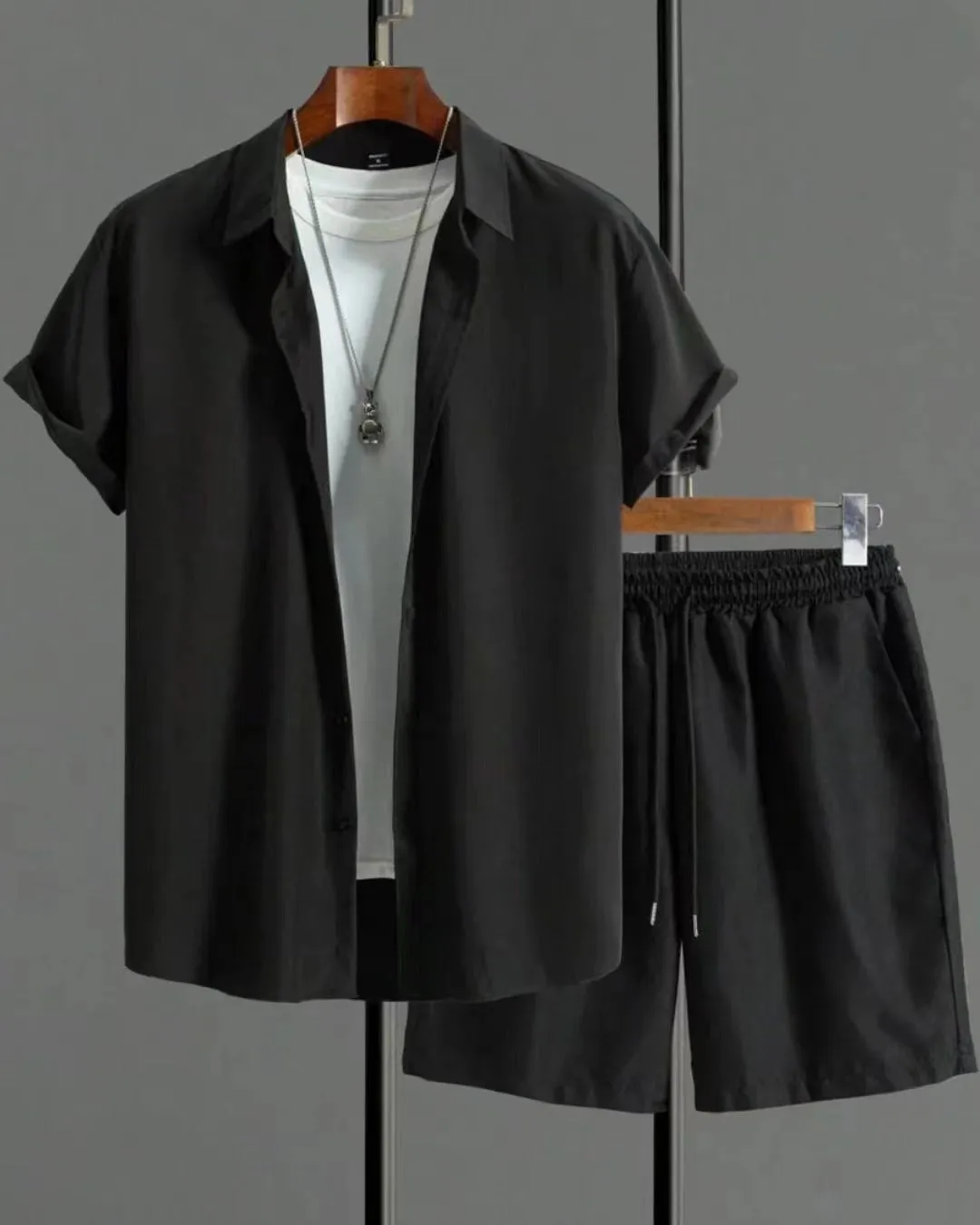 Short sleeve jacquard suit set with shorts in solid colour on a hanger