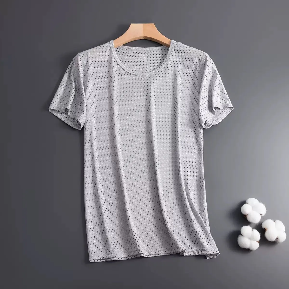 Man wearing a grey ice silk short sleeve crew neck t-shirt showing mesh fabric texture.