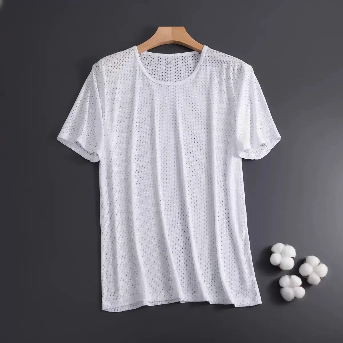 Man wearing a grey ice silk short sleeve crew neck t-shirt showing mesh fabric texture.