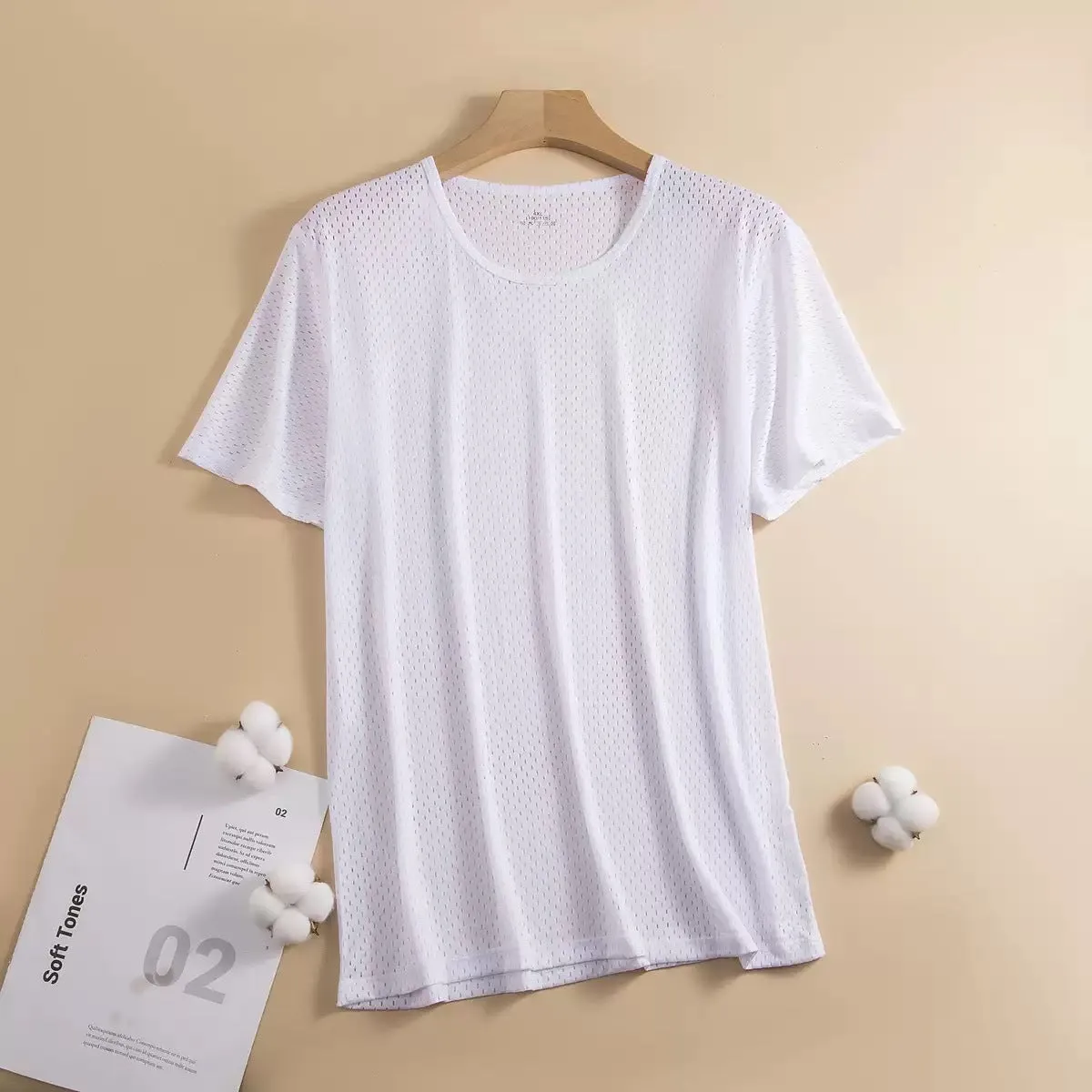 Man wearing a grey ice silk short sleeve crew neck t-shirt showing mesh fabric texture.