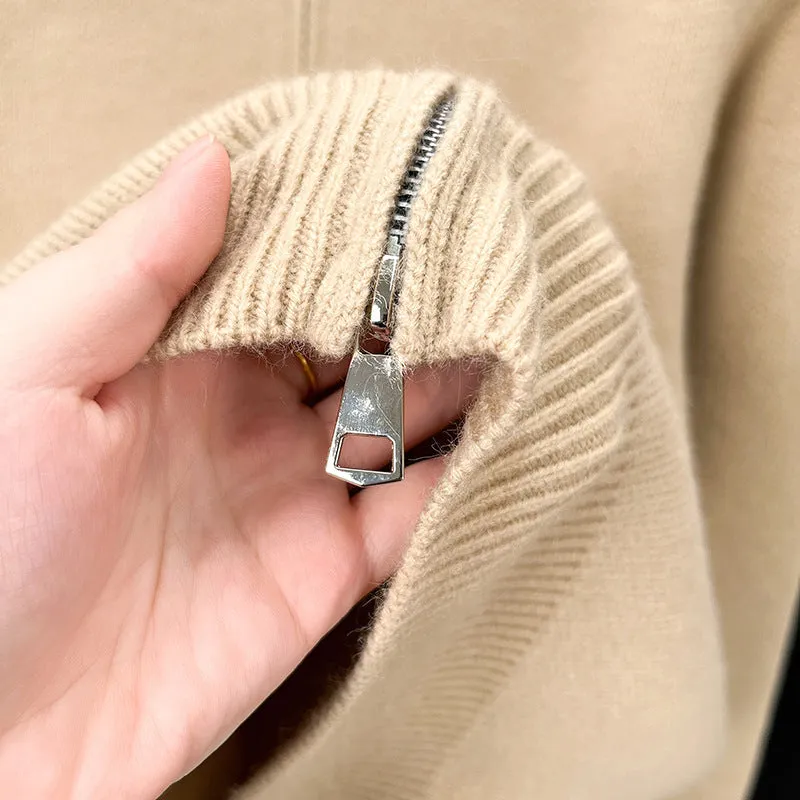 Man wearing a grey stand collar knitted cardigan with a front zipper.