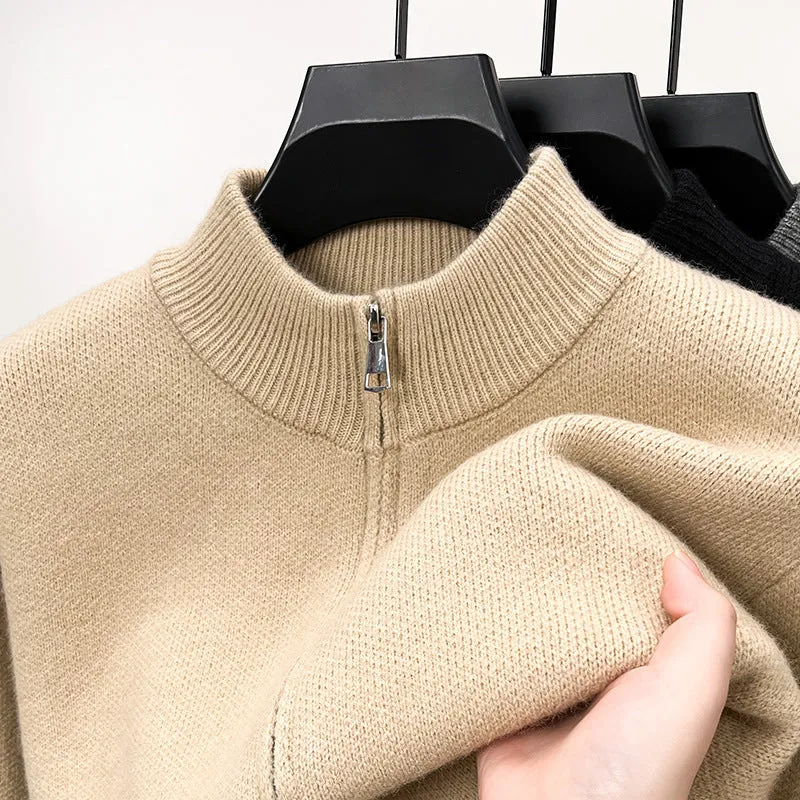 Man wearing a grey stand collar knitted cardigan with a front zipper.
