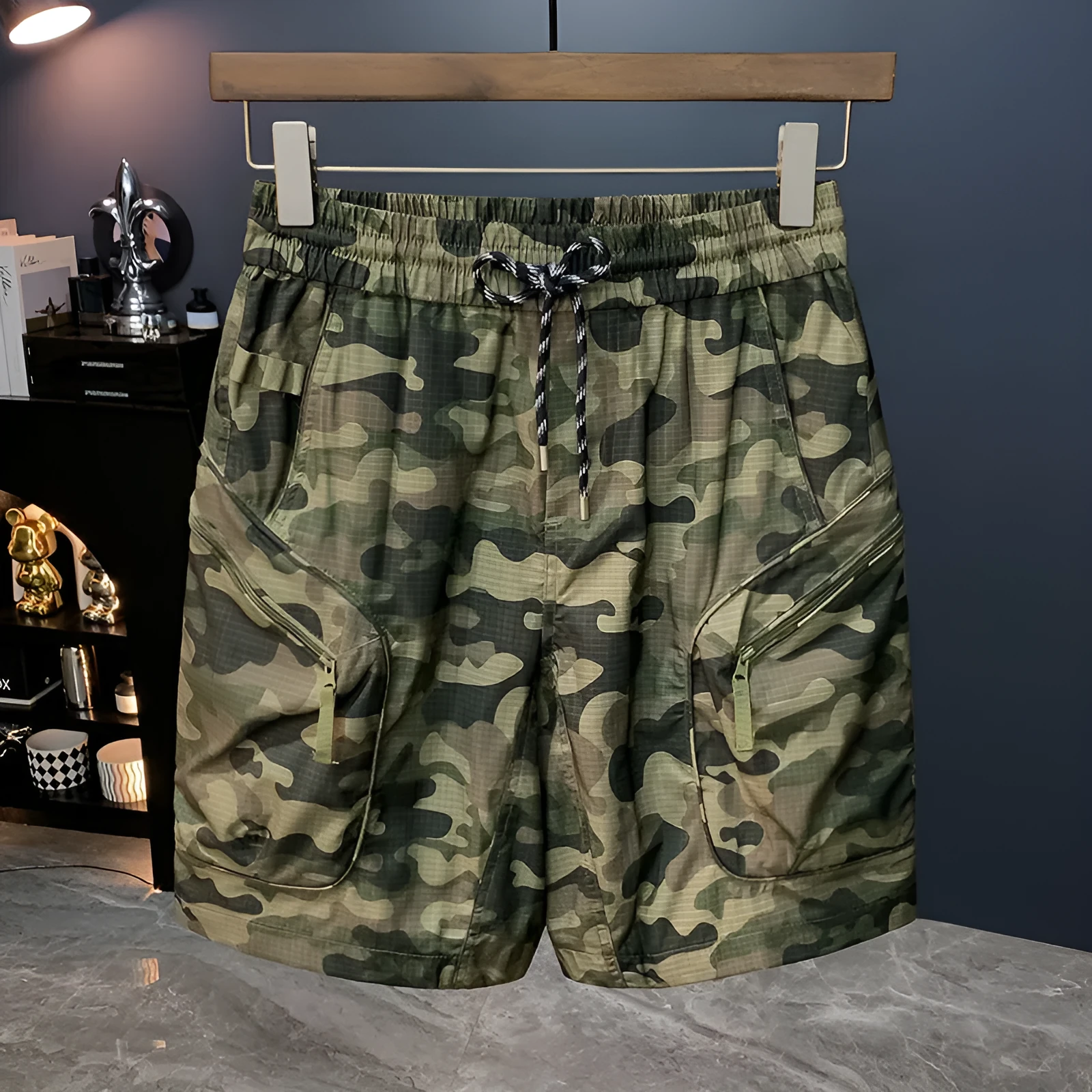 Man wearing loose-fit camouflage cargo shorts with cargo pockets and an elasticated waistband.