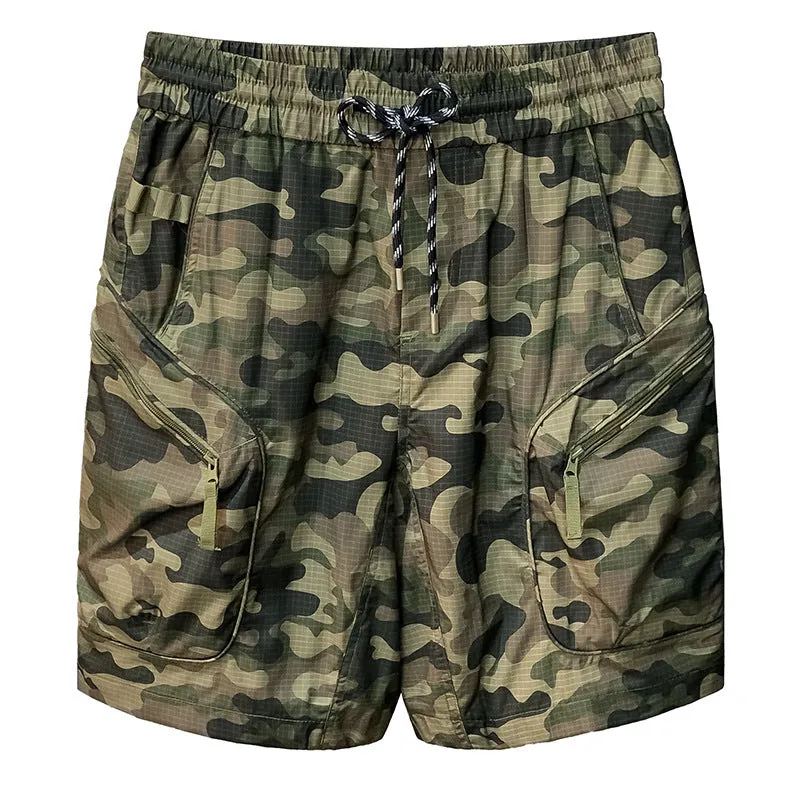 Man wearing loose-fit camouflage cargo shorts with cargo pockets and an elasticated waistband.