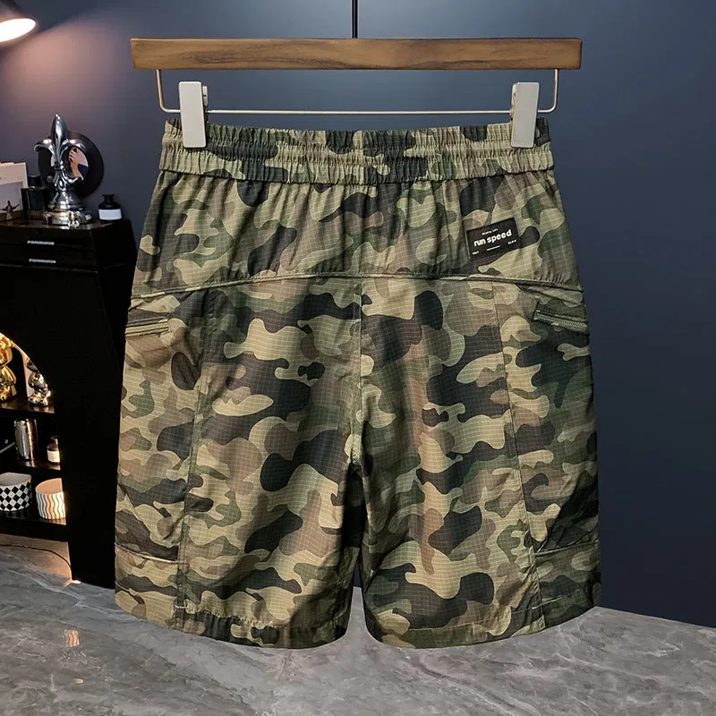 Man wearing loose-fit camouflage cargo shorts with cargo pockets and an elasticated waistband.