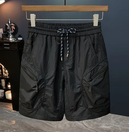 Man wearing loose-fit camouflage cargo shorts with cargo pockets and an elasticated waistband.