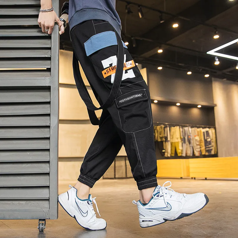 Men's Hong Kong fashion workwear casual pants with multi-pockets, loose fit, zip fly, in Black colour, T400 fabric