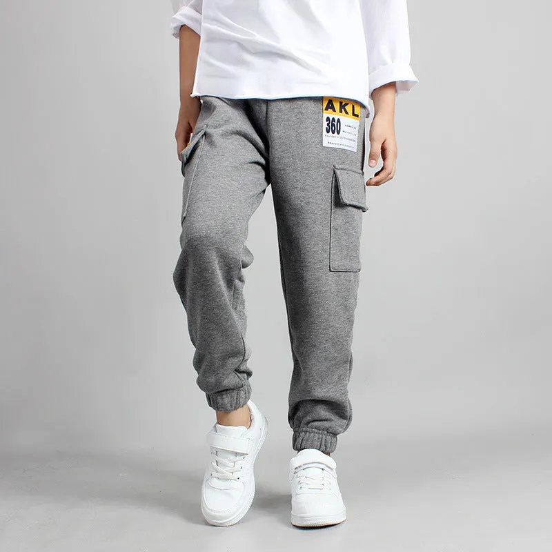 Boys' cotton track pants in black size 120cm on a child model