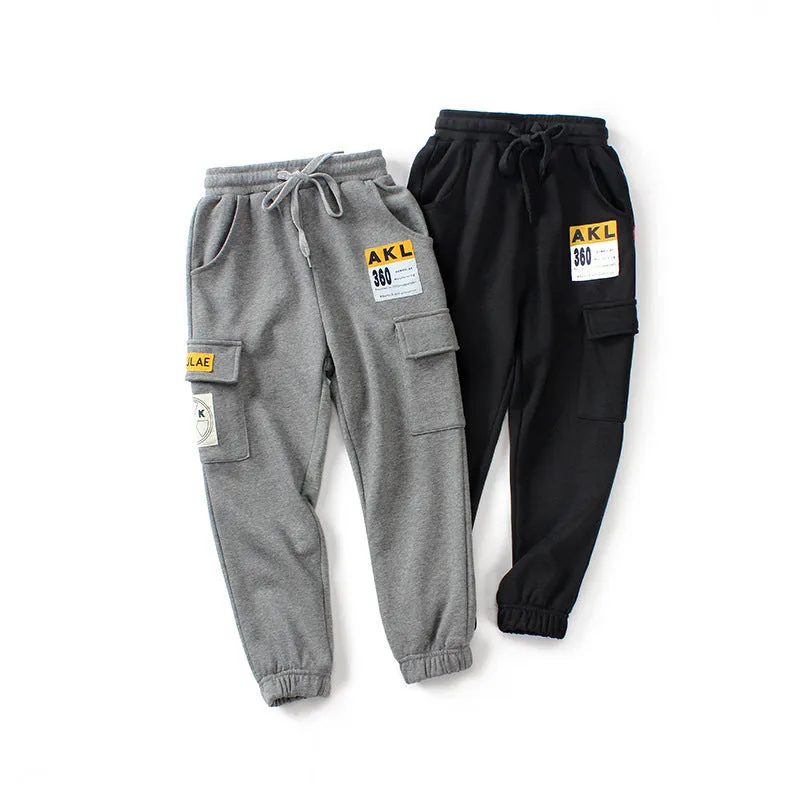 Boys' cotton track pants in black size 120cm on a child model
