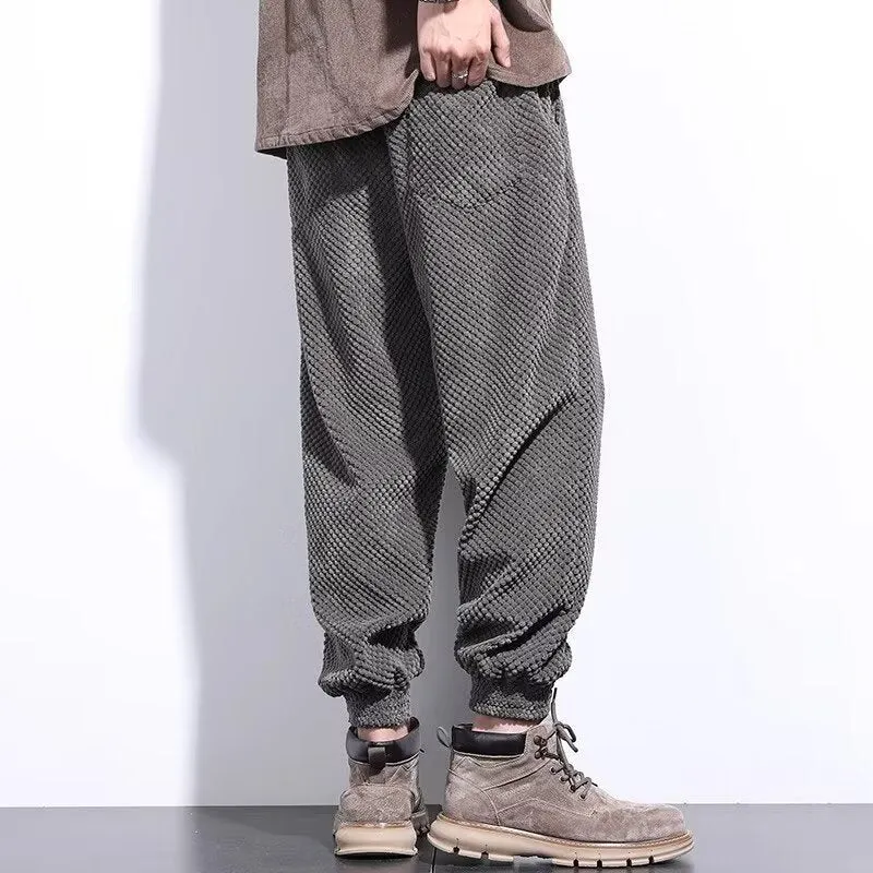 Men's grey ankle-tied casual sport sweatpants with straight leg design on hanger