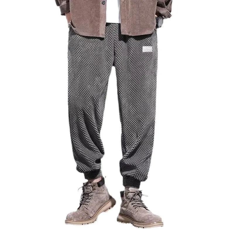 Men's grey ankle-tied casual sport sweatpants with straight leg design on hanger