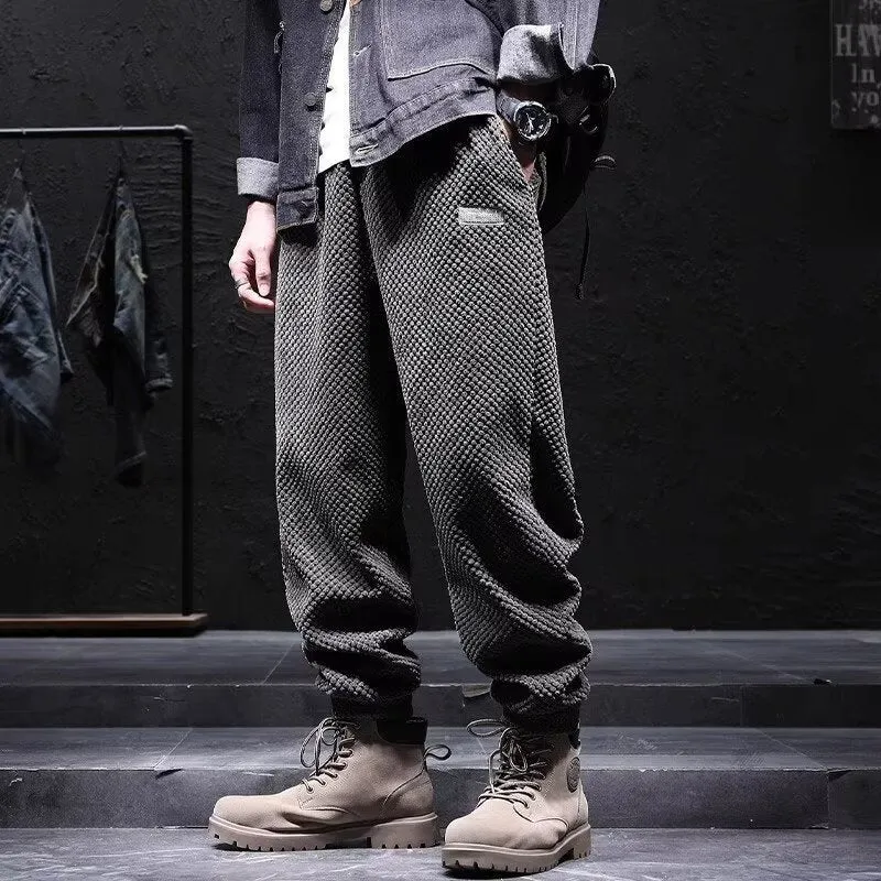 Men's grey ankle-tied casual sport sweatpants with straight leg design on hanger