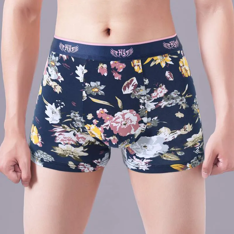 Men's floral print cotton boxer shorts showing the U-shaped pouch design and available colour variations.