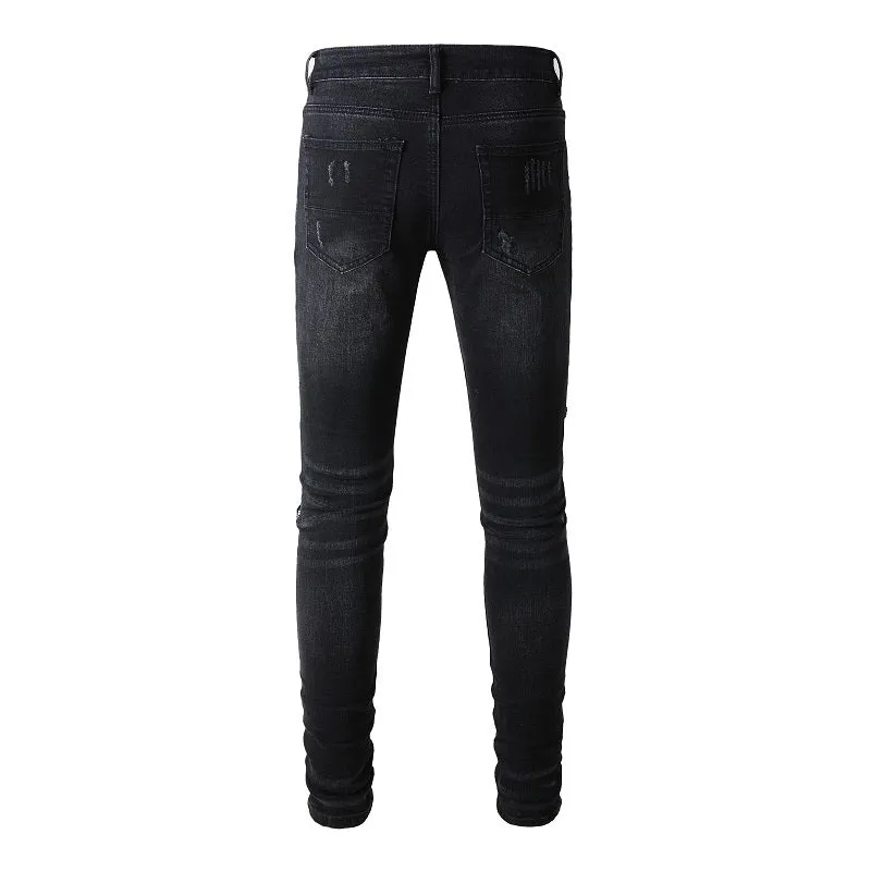 Men's black denim jeans with tattered hem and simple print patch detail