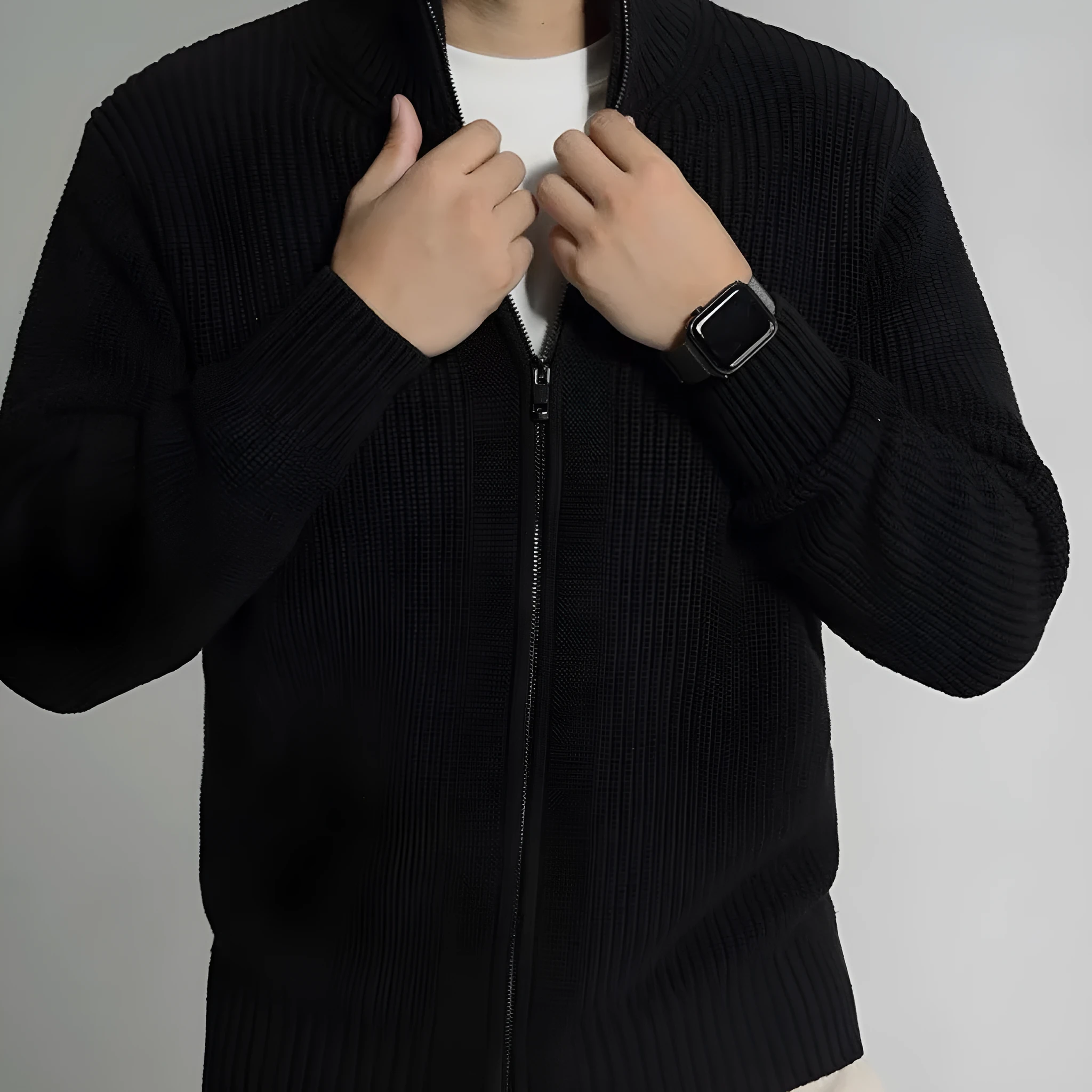 Men's loose fit black modal cardigan sweater on model, front view, size L
