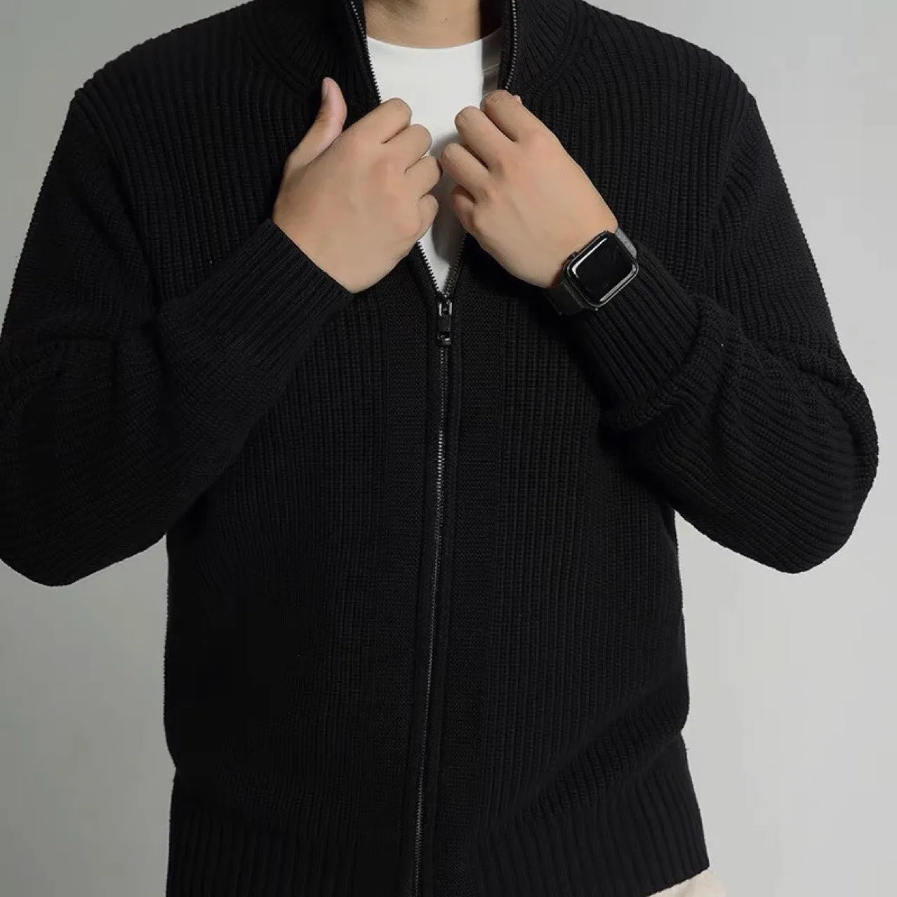 Men's loose fit black modal cardigan sweater on model, front view, size L