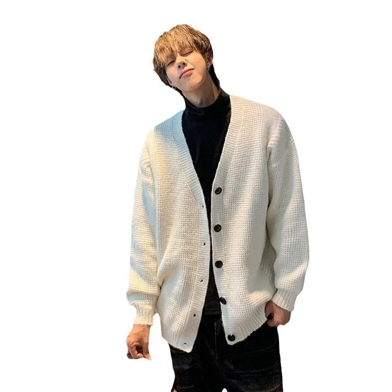 Men's solid colour V-neck knitted cardigan sweater in a loose fit on a hanger.
