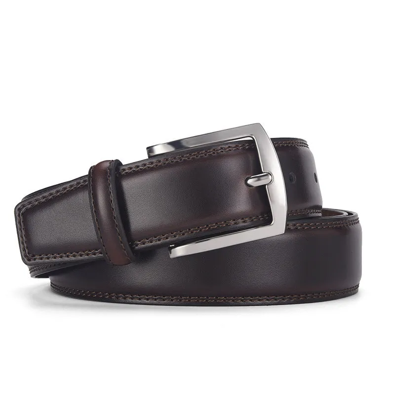 Men's black genuine leather belt with silver alloy pin buckle on a flat surface