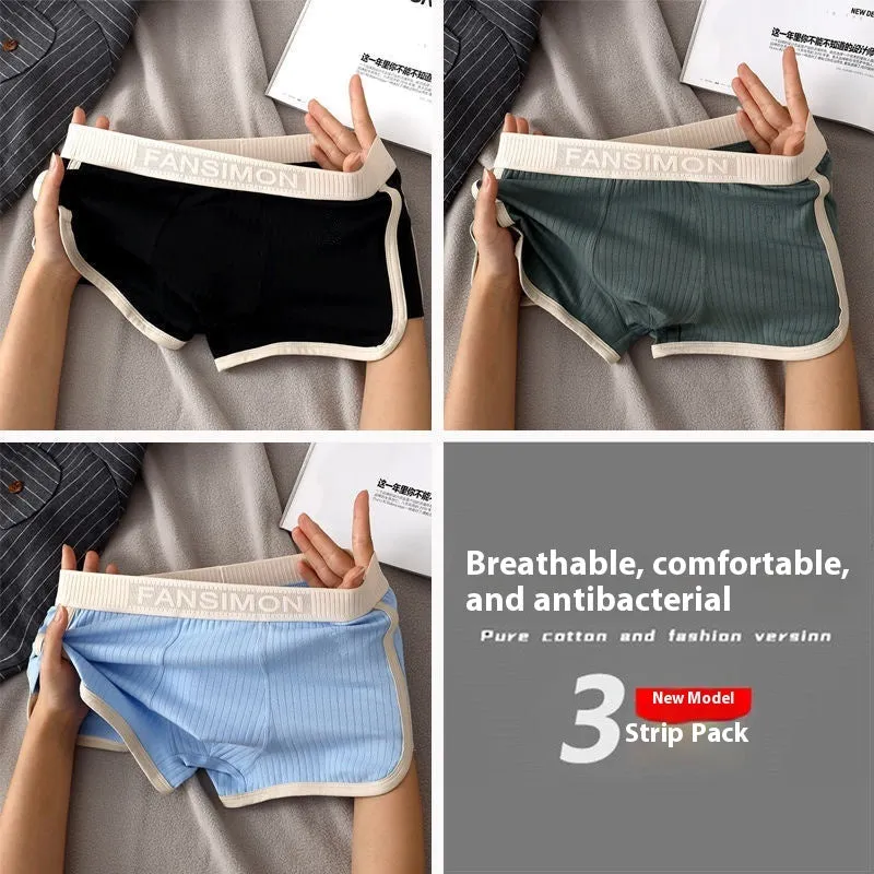 Three-pack of men's milk silk polyester boxer shorts in solid colours on a white background