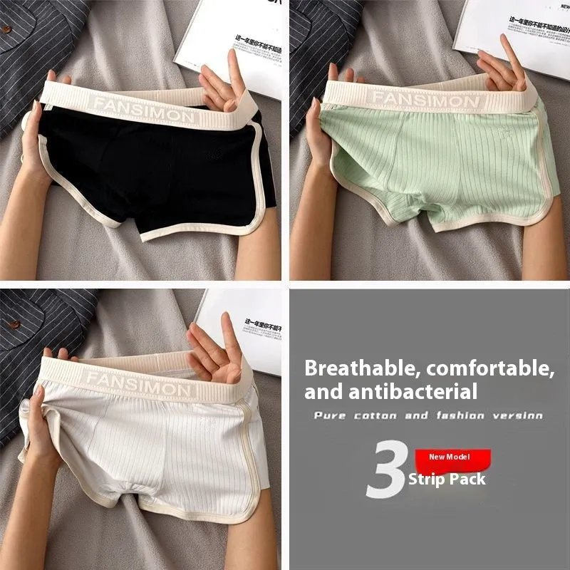 Three-pack of men's milk silk polyester boxer shorts in solid colours on a white background