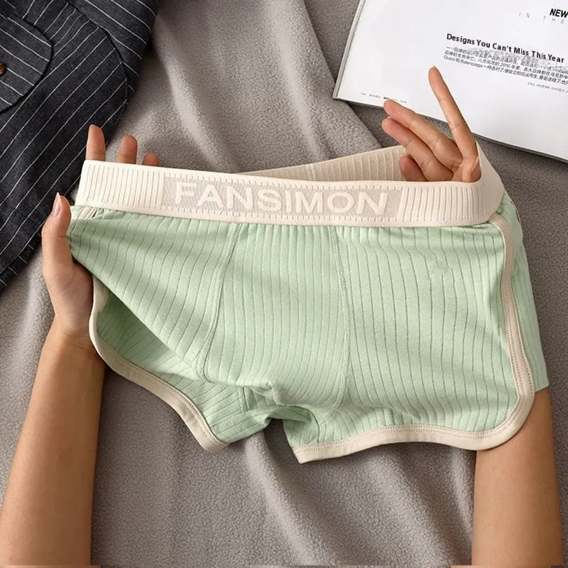 Three-pack of men's milk silk polyester boxer shorts in solid colours on a white background
