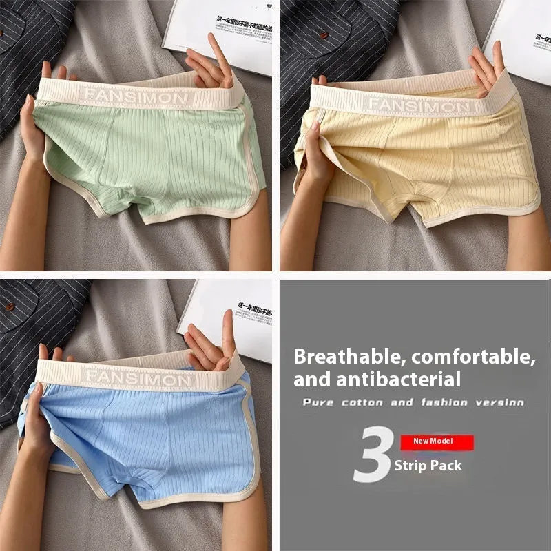Three-pack of men's milk silk polyester boxer shorts in solid colours on a white background