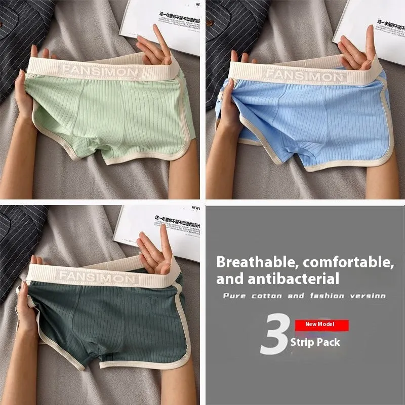 Three-pack of men's milk silk polyester boxer shorts in solid colours on a white background