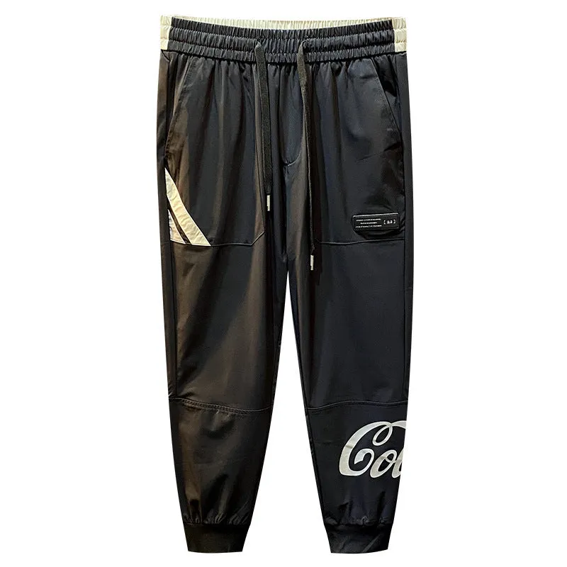 Man wearing black ultra-thin ice silk cropped trousers with a banded ankle cuff.