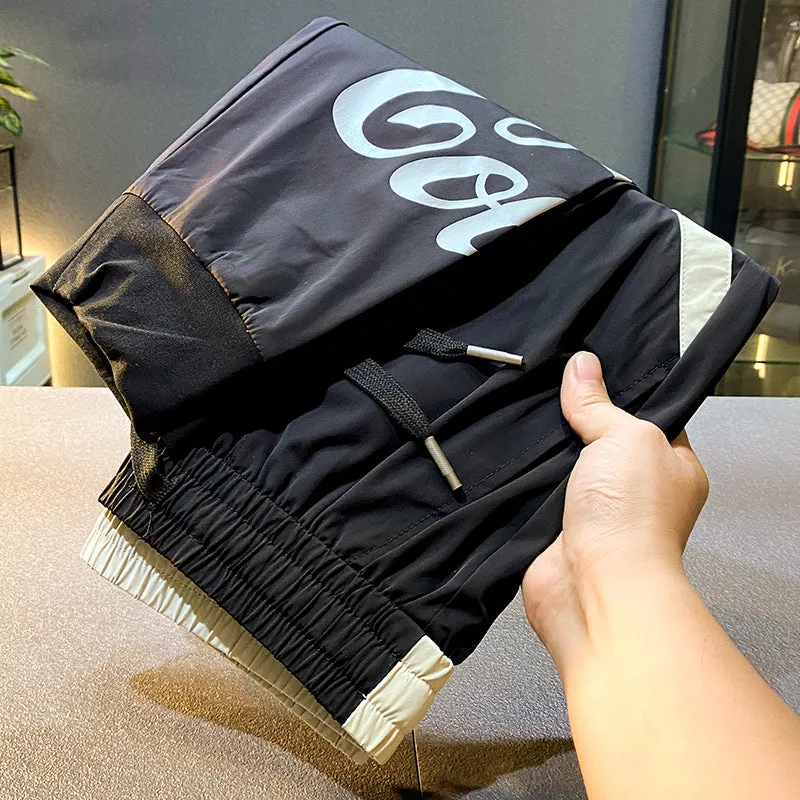 Man wearing black ultra-thin ice silk cropped trousers with a banded ankle cuff.