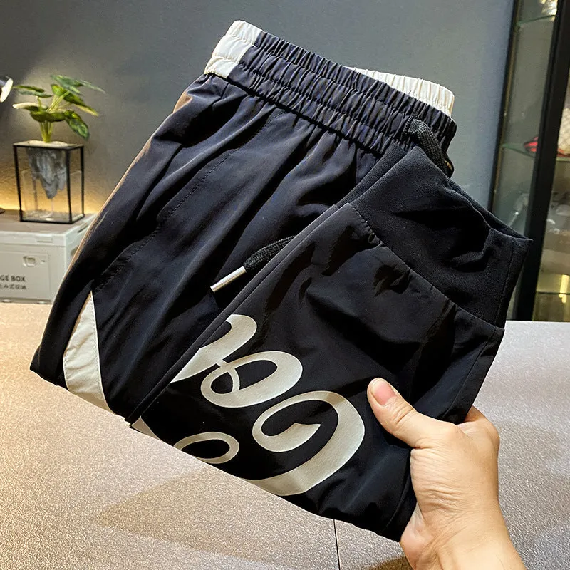 Man wearing black ultra-thin ice silk cropped trousers with a banded ankle cuff.
