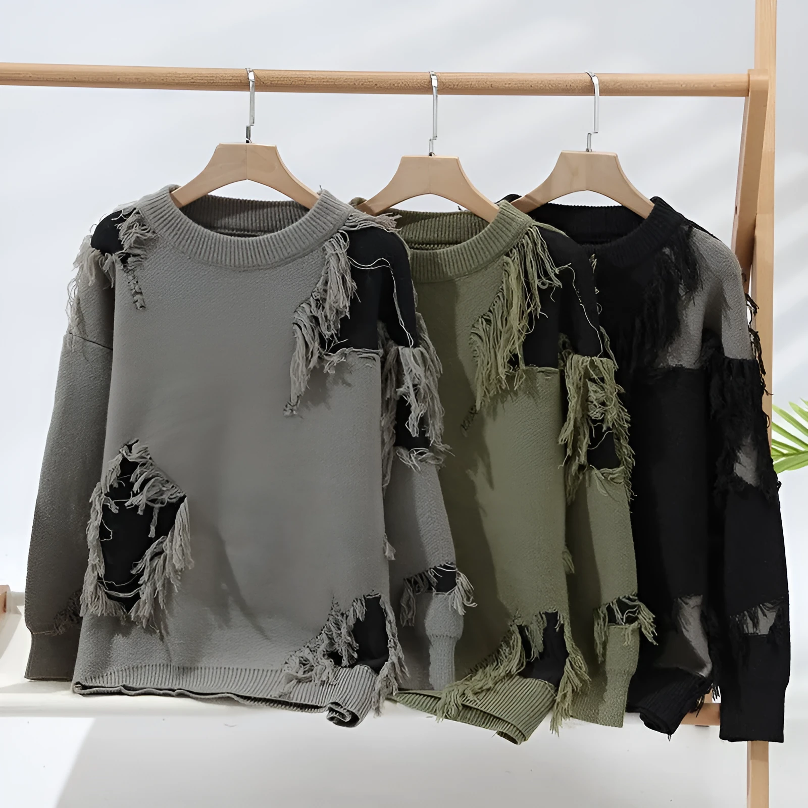 Fashion casual round neck loose men's sweater in black polyester knit, front view